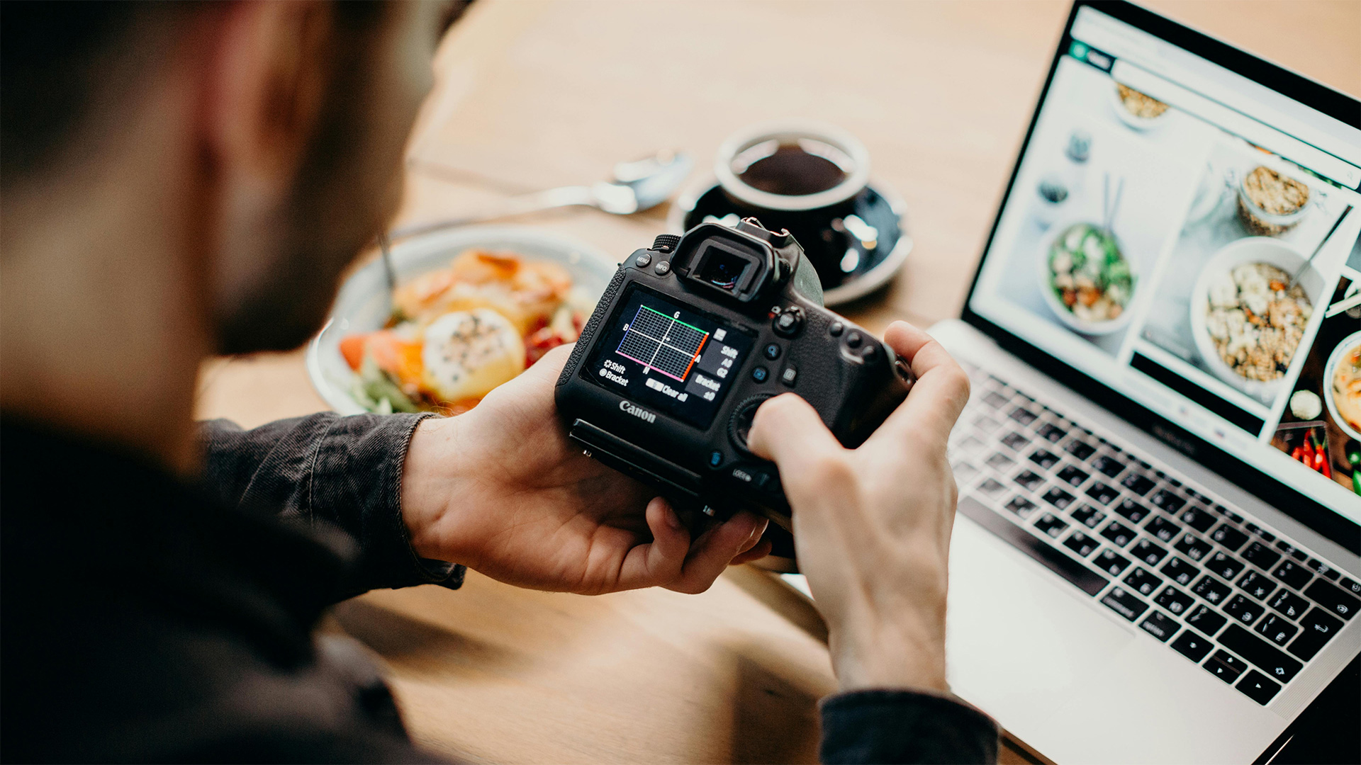 man setting up his camera settings