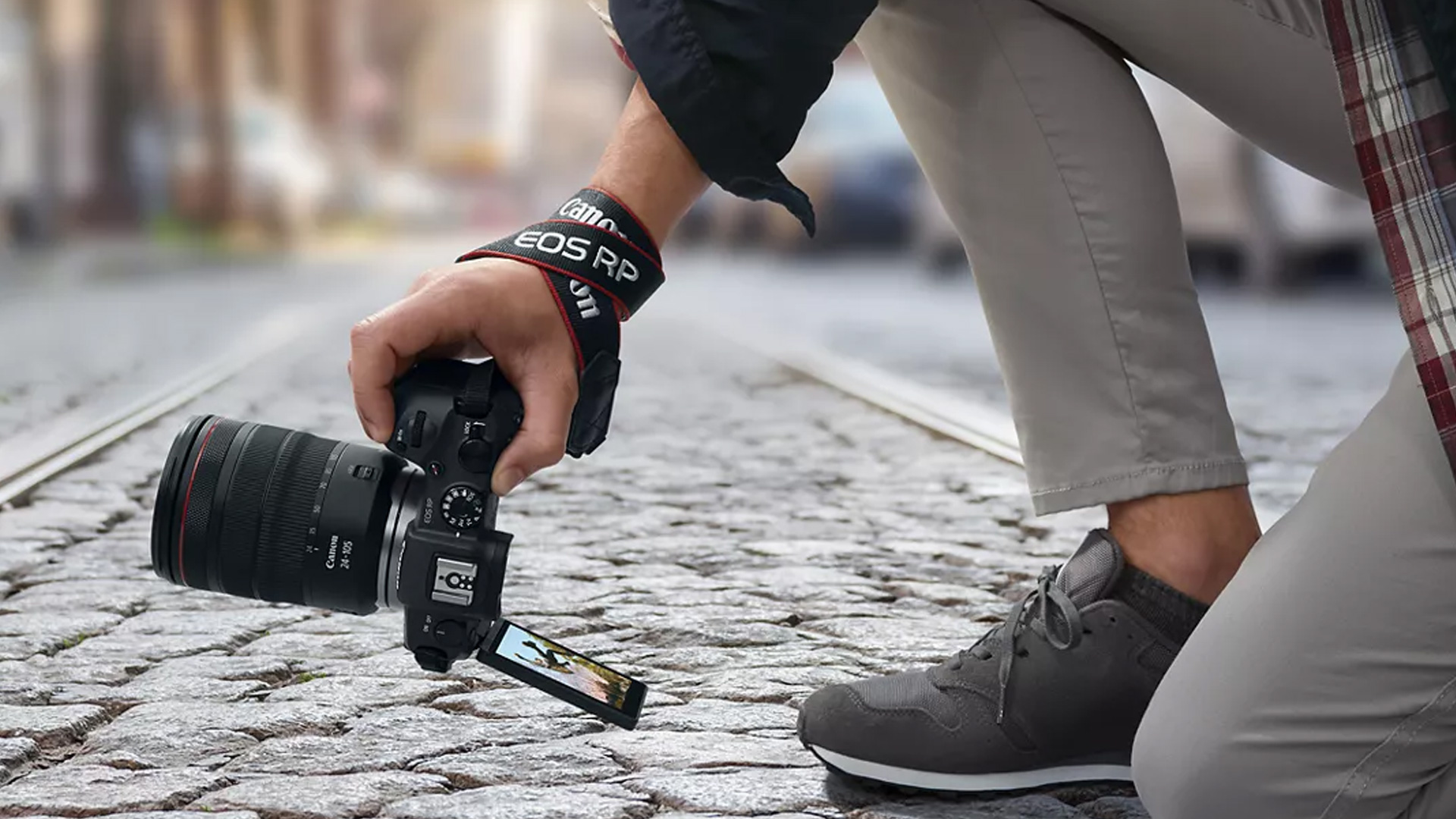 man holding a Canon EOS RP