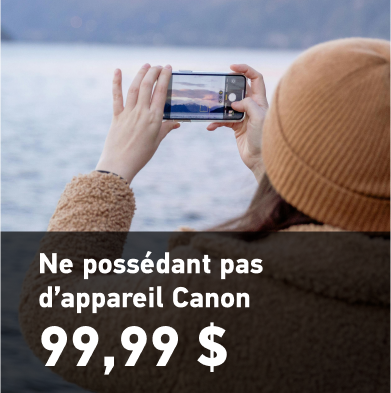 Femme photographiant avec son téléphone dans un paysage glacé. Non-propriétaires d’appareils photo Canon 99,99 $