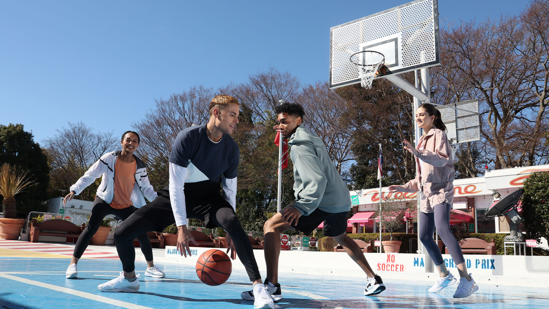 EOS R100 shot of people playing basketball