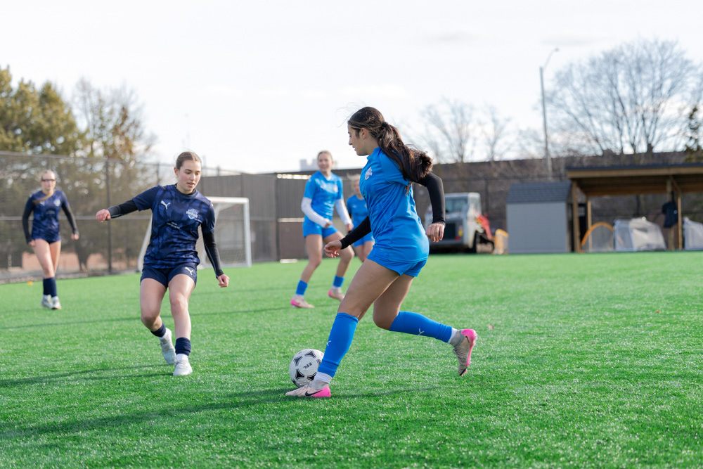 Girl playing soccer