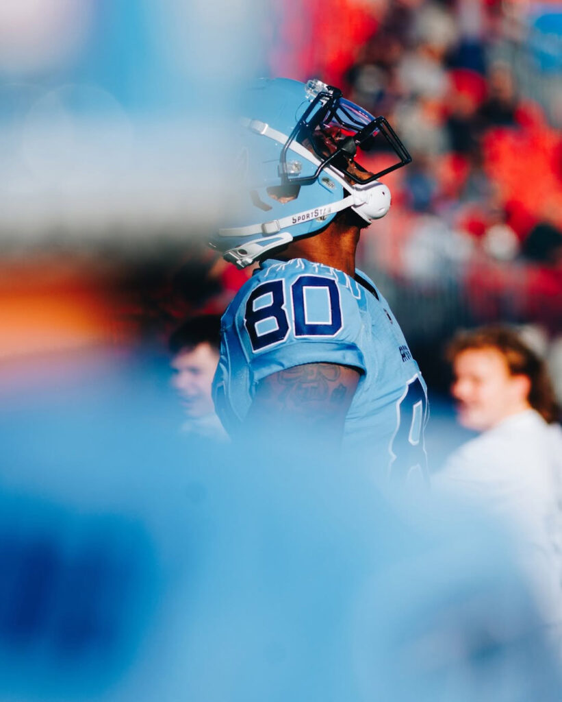 an american football player looking up
