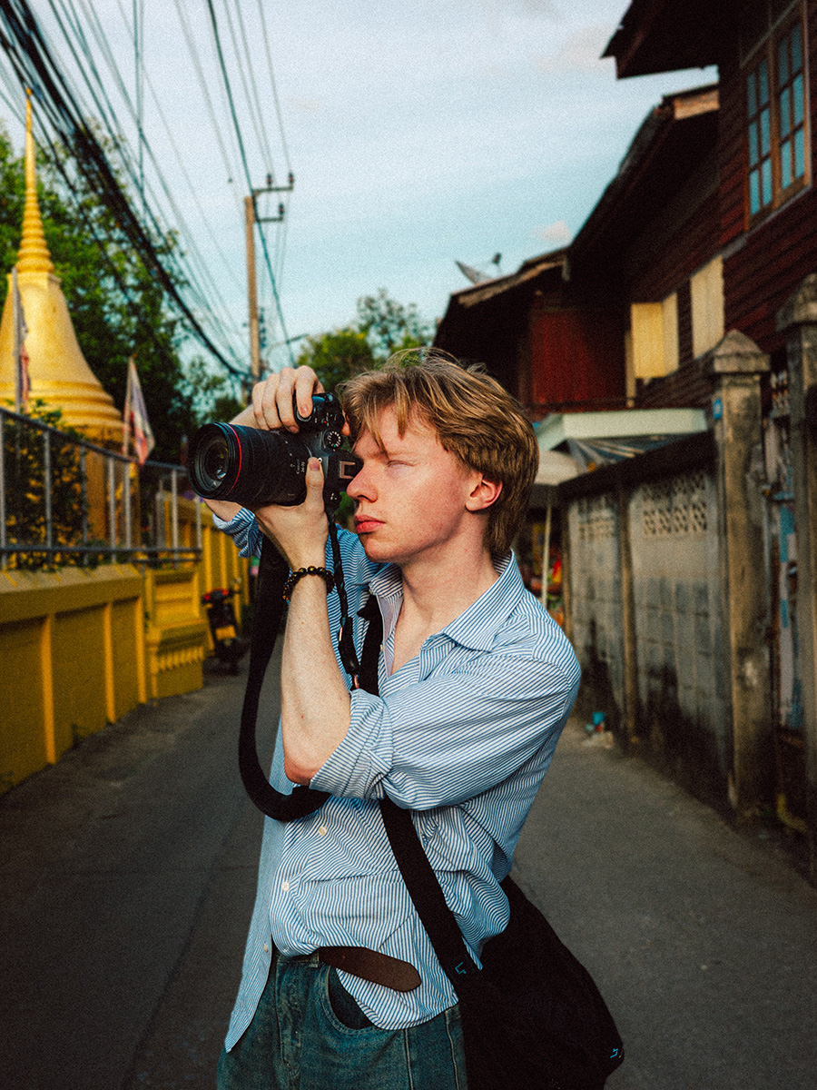 Matt Solie shooting with a Canon camera in the streets