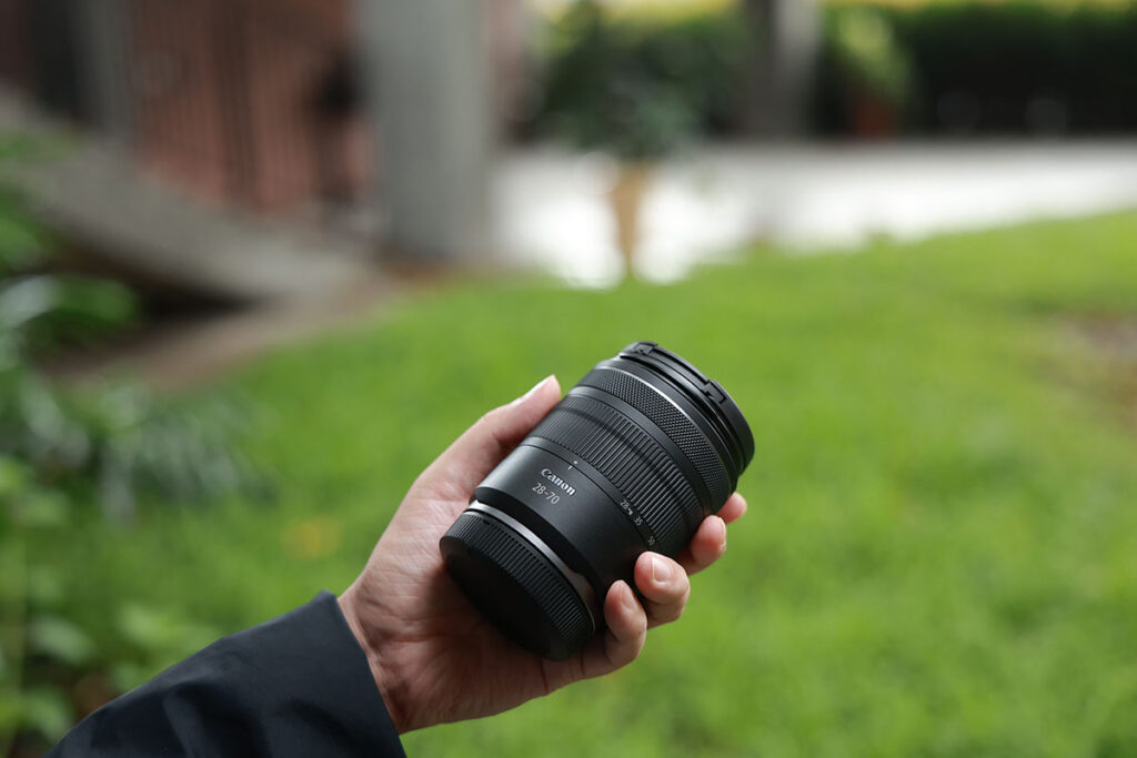 man holding a RF28-70mm F2.8 IS STM